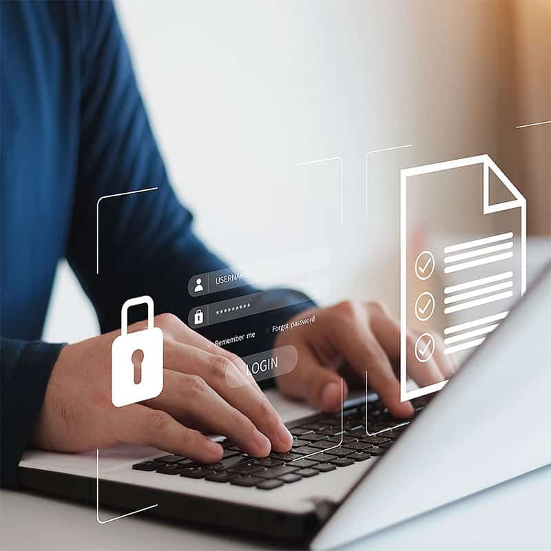 Man typing on a laptop taking a cyber security fundamentals course.