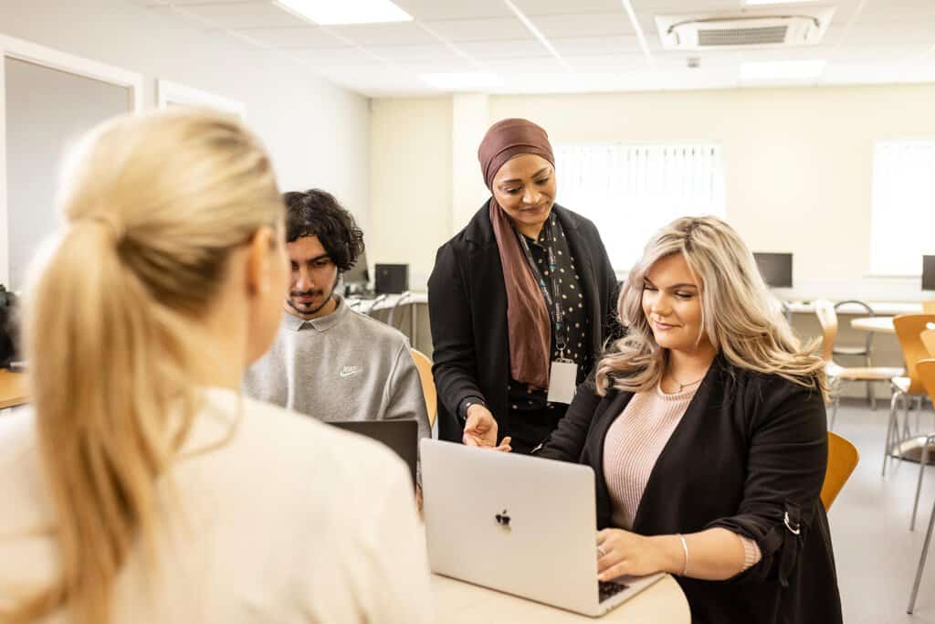 Photo of a tutor with students