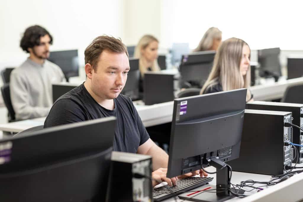 Photo of an IT worker in an office environment