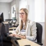 Photo of a person working on a computer