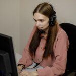 A digital support professional speaks to a user via video call